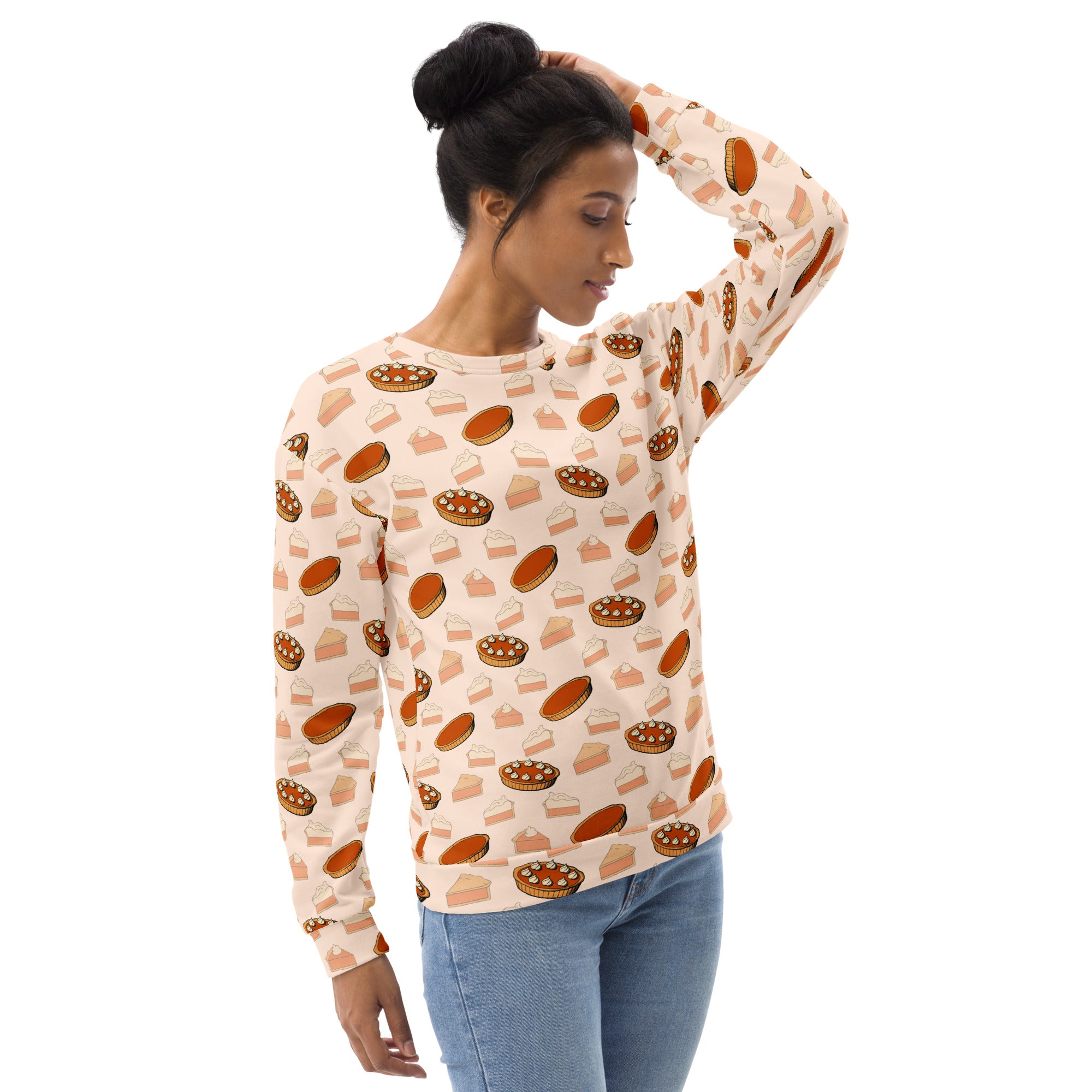 A cream-colored long-sleeved pumpkin pie thanksgiving sweatshirt with brushed inner fleece and playful pie pattern