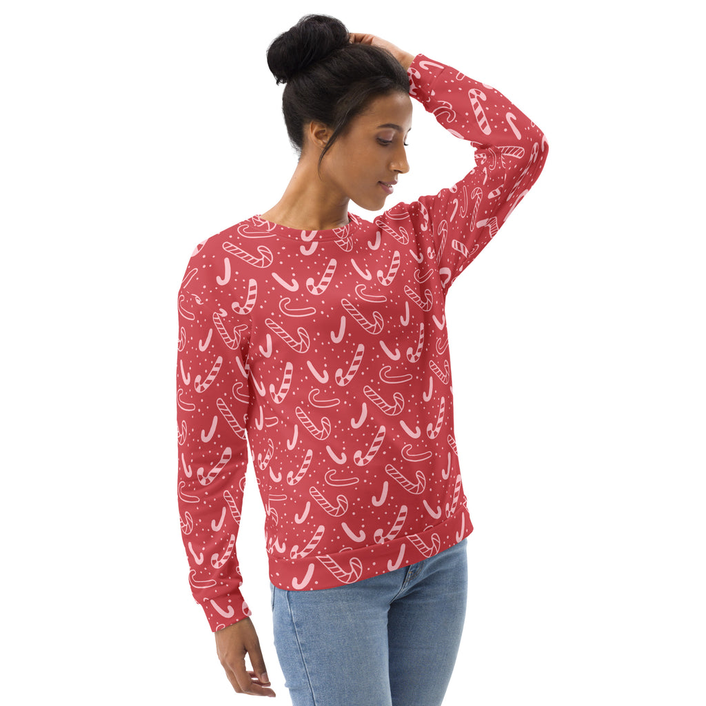 Red candy cane christmas sweatshirt with brushed inner fleece fabric featuring a white candy cane pattern