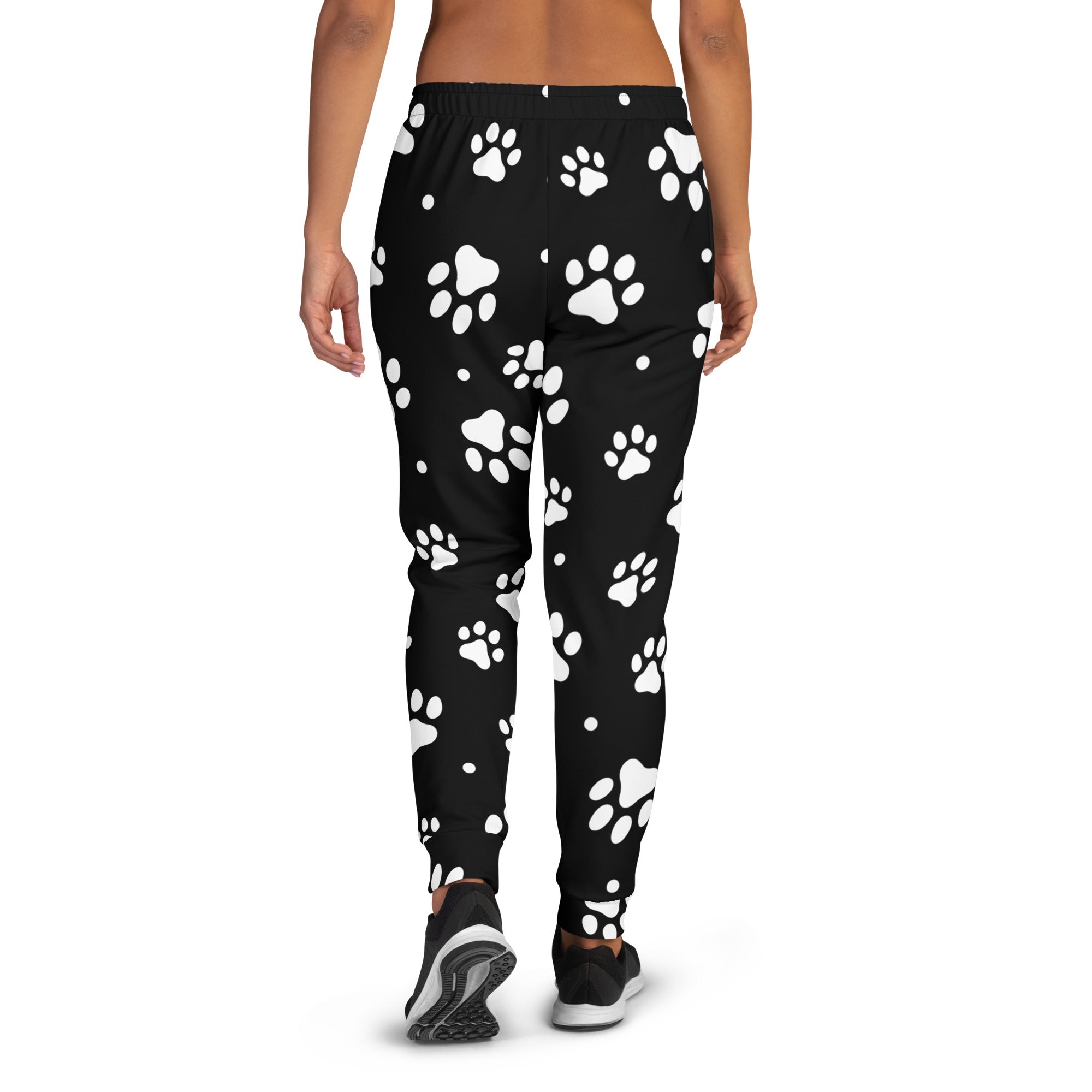 Women’s black jogger pants with white paw print pattern cozy brushed inside fleece and pockets made from recycled material