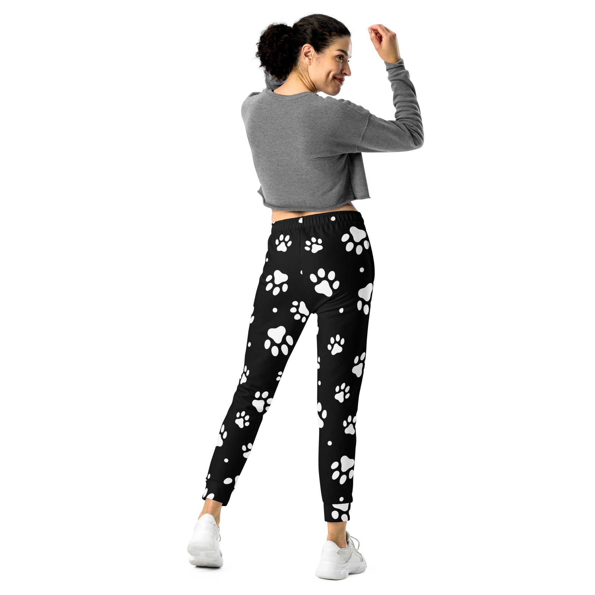 Women’s black jogger pants with playful white paw print pattern cozy brushed inside fleece material with pockets