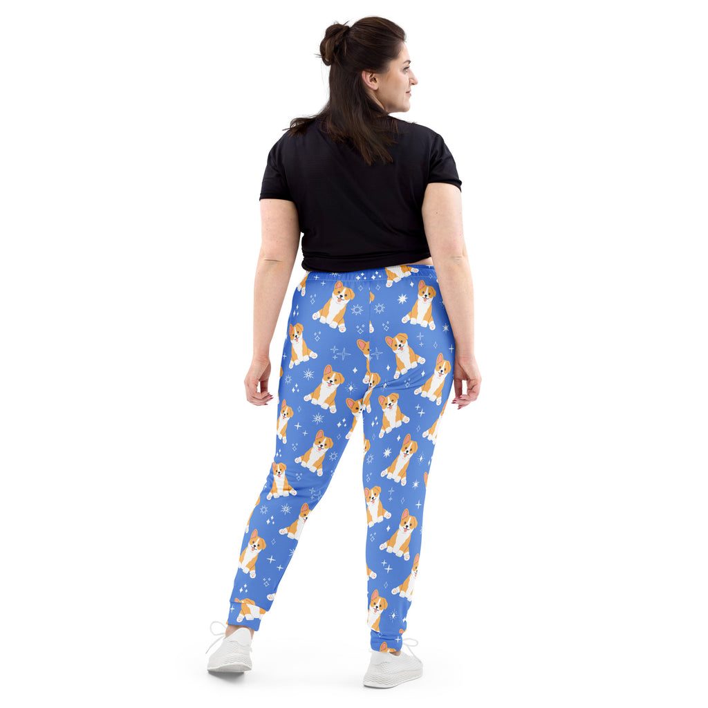 Women’s blue recycled jogger pants with cozy brushed fleece inside featuring orange and white corgi puppy pattern