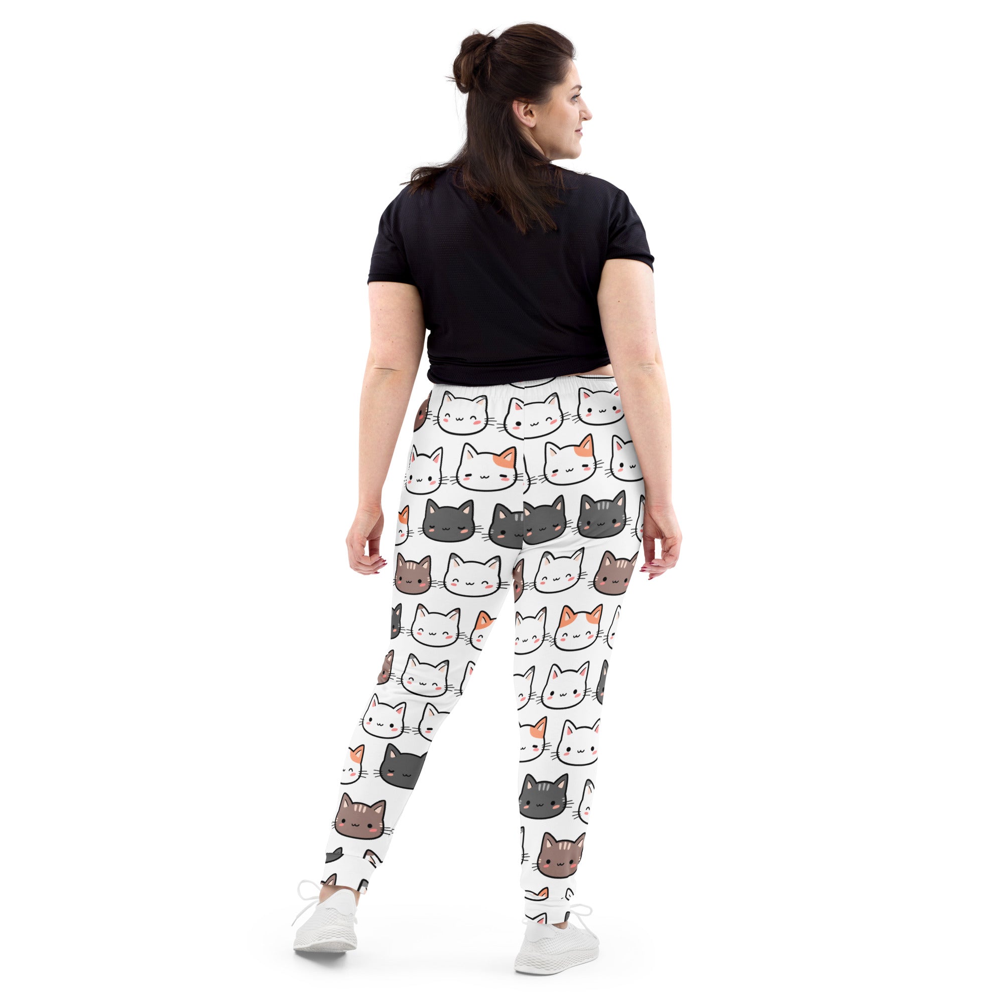 White leggings with colorful cartoon cat faces featuring cozy brushed fleece inside and pockets for women