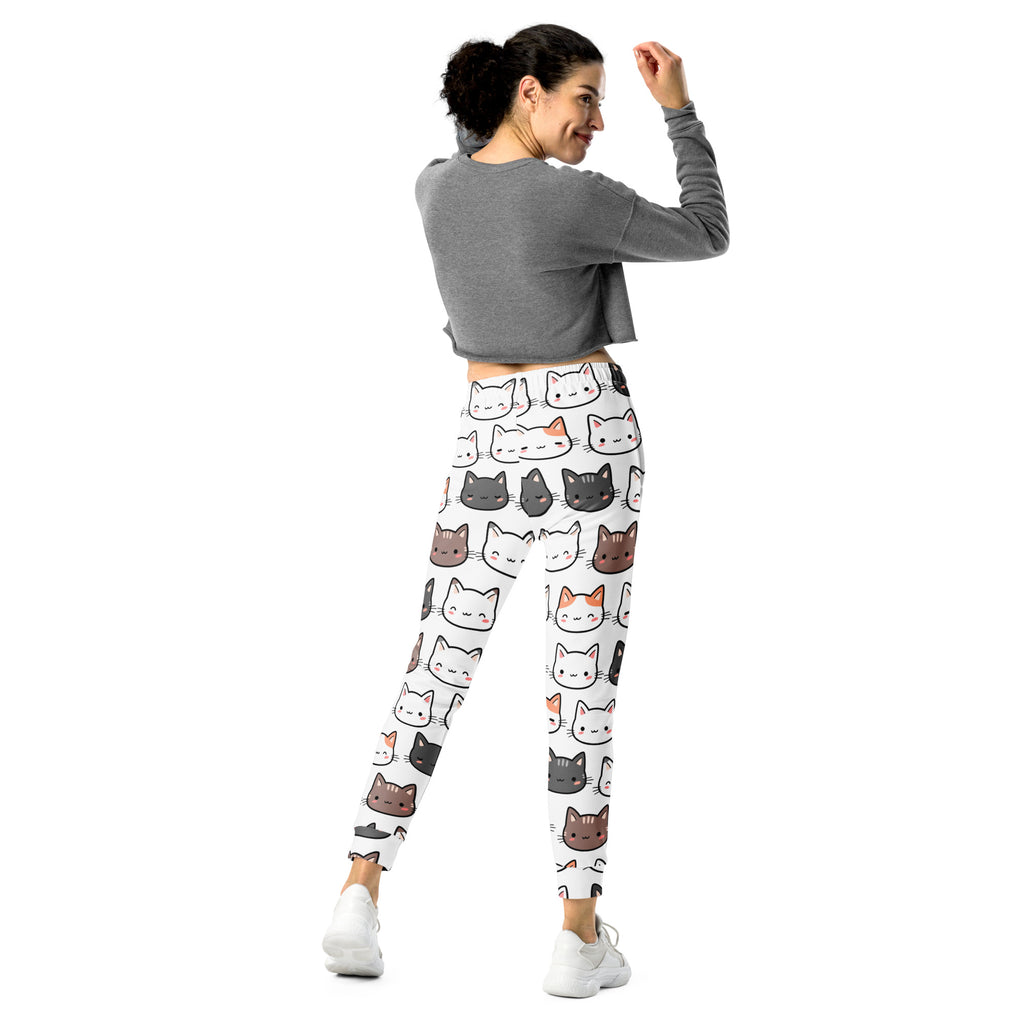 Women’s white recycled jogger pants with cozy fleece inside featuring colorful cartoon cat patterns and pockets