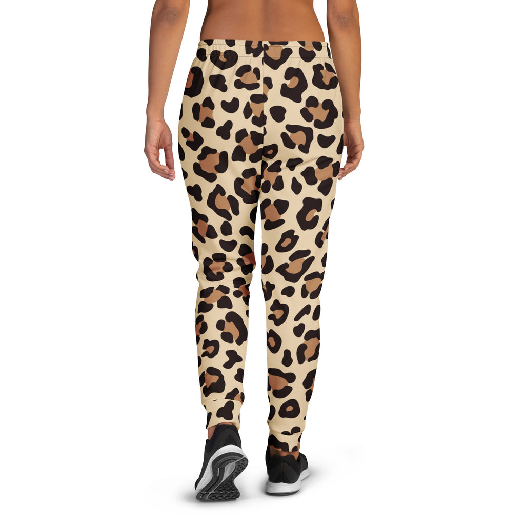 Women’s cream-colored leopard print recycled jogger pants with black and tan spots featuring cozy fleece inside and pockets