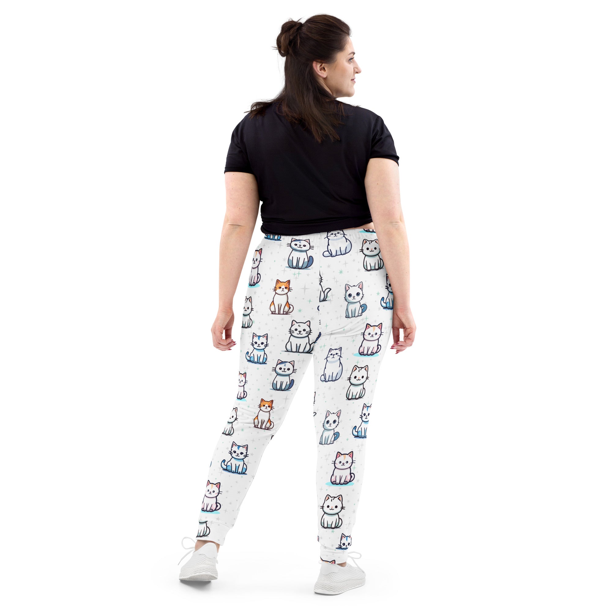 Women’s white pajama jogger pants with cozy brushed fleece and colorful cartoon cat pattern and pockets