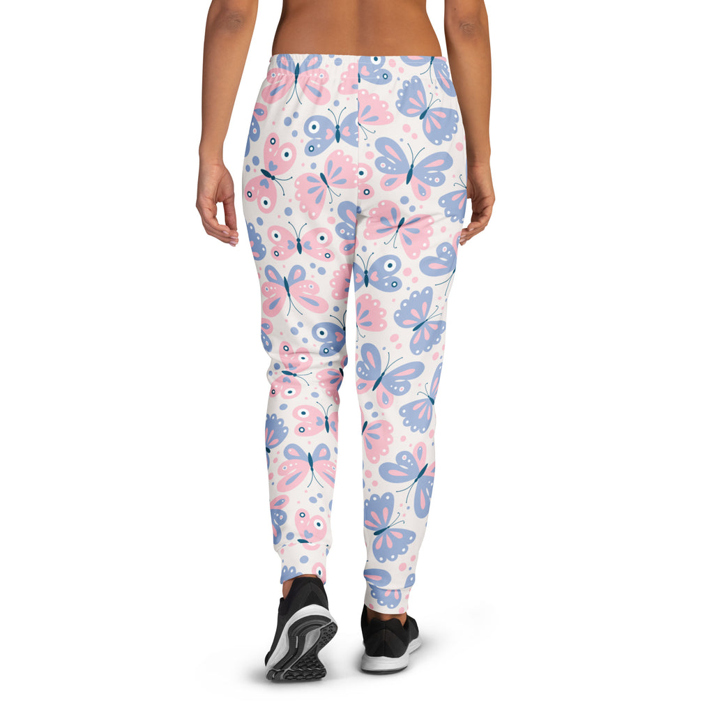 White women’s jogger pants with pink and blue cartoon butterflies made from cozy recycled fleece with pockets