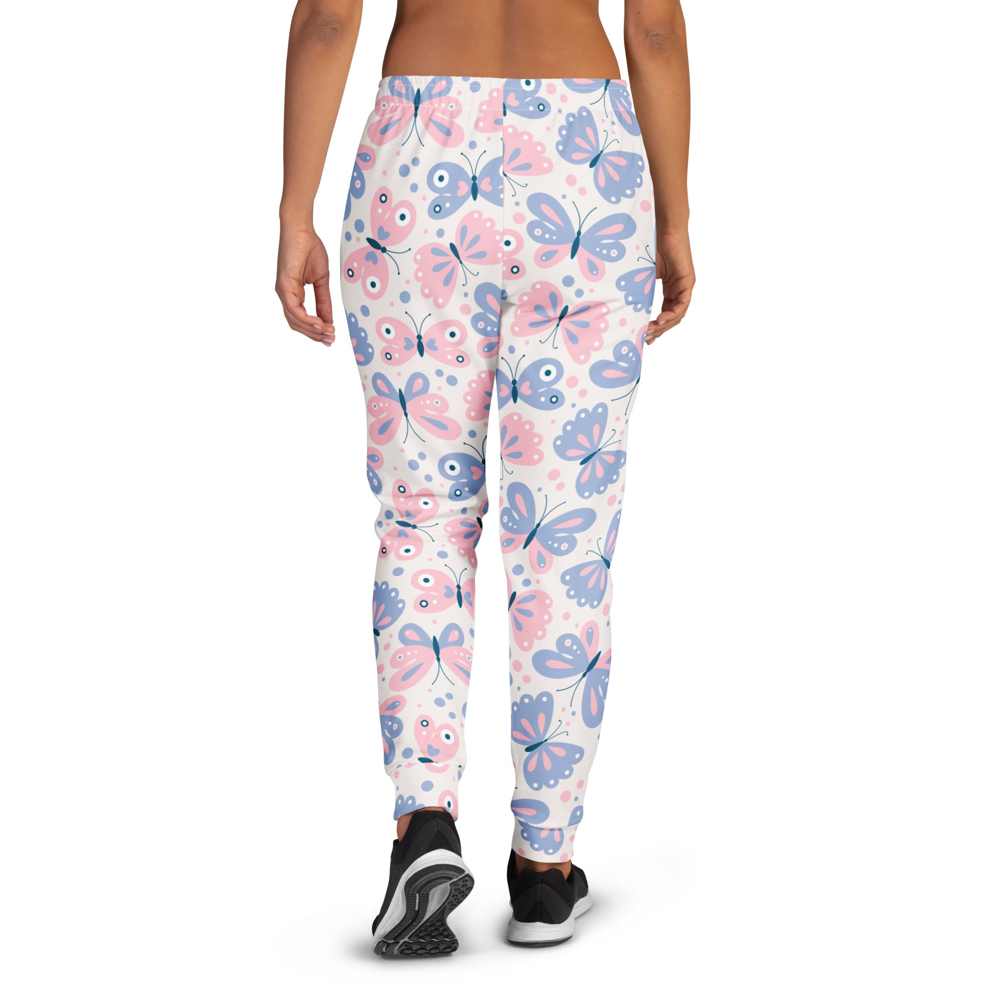 White women’s jogger pants with pink and blue cartoon butterflies made from cozy recycled fleece with pockets