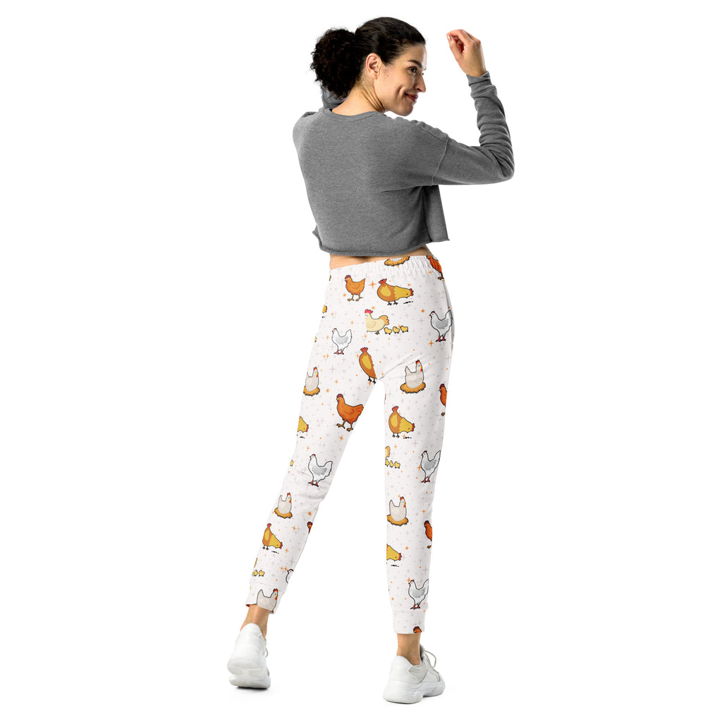 White leggings with playful orange brown and gray cartoon chicken pattern made from cozy brushed inside fleece