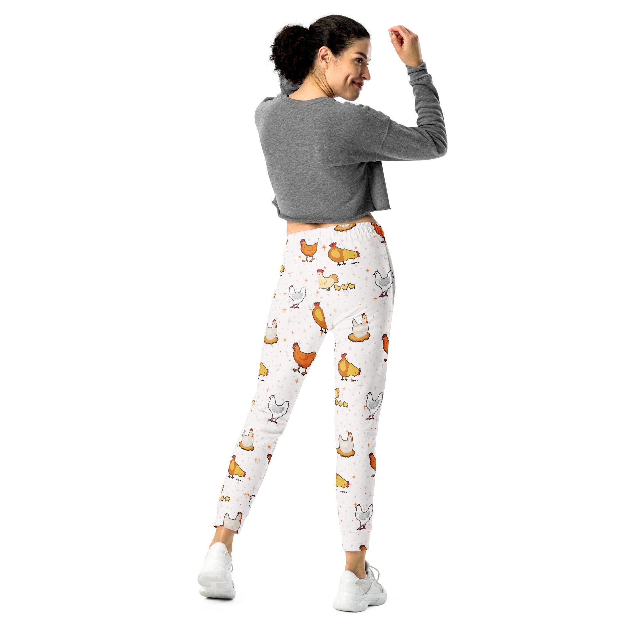 White leggings with playful orange brown and gray cartoon chicken pattern made from cozy brushed inside fleece