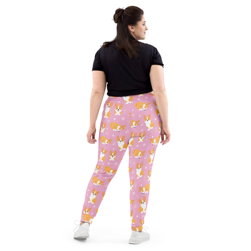 Women’s pink corgi dog recycled jogger pants with pockets and cozy brushed inside fleece featuring orange and white dogs