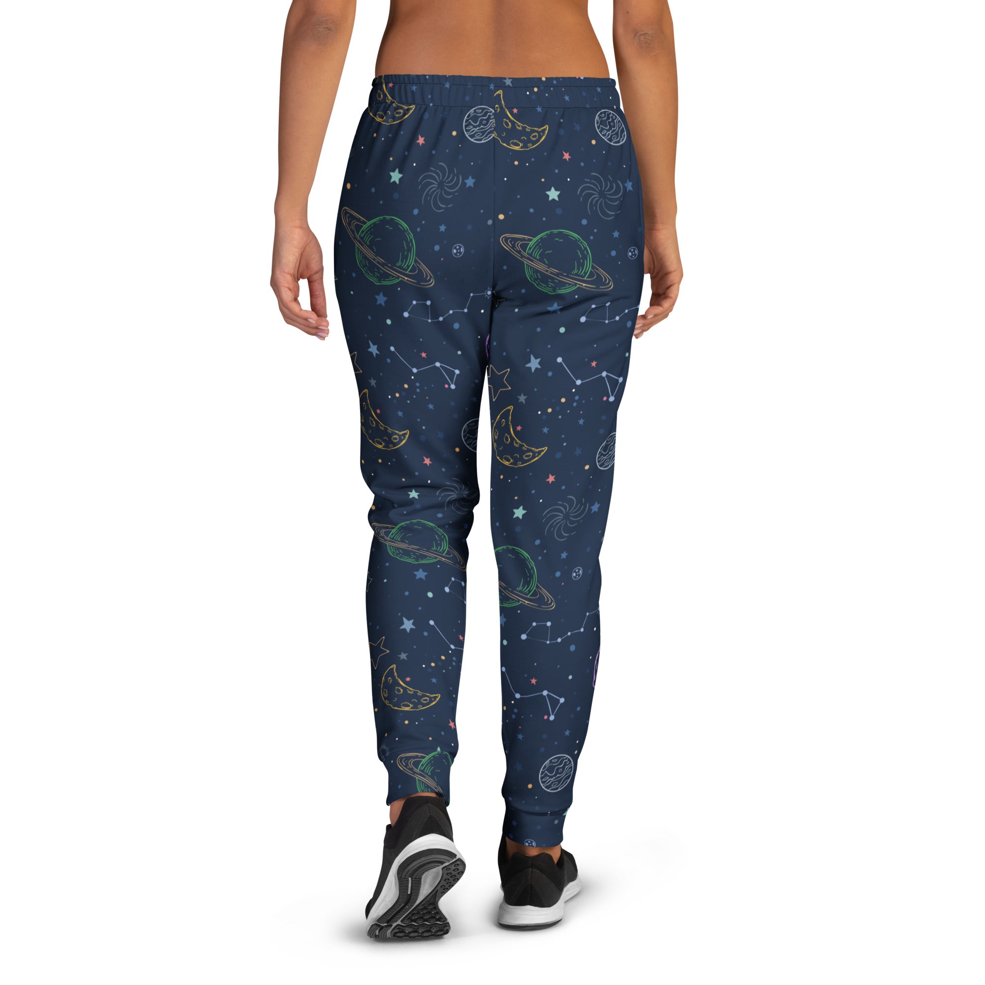 Dark blue women’s jogger pants with whimsical space-themed print and cozy brushed inside fleece with pockets
