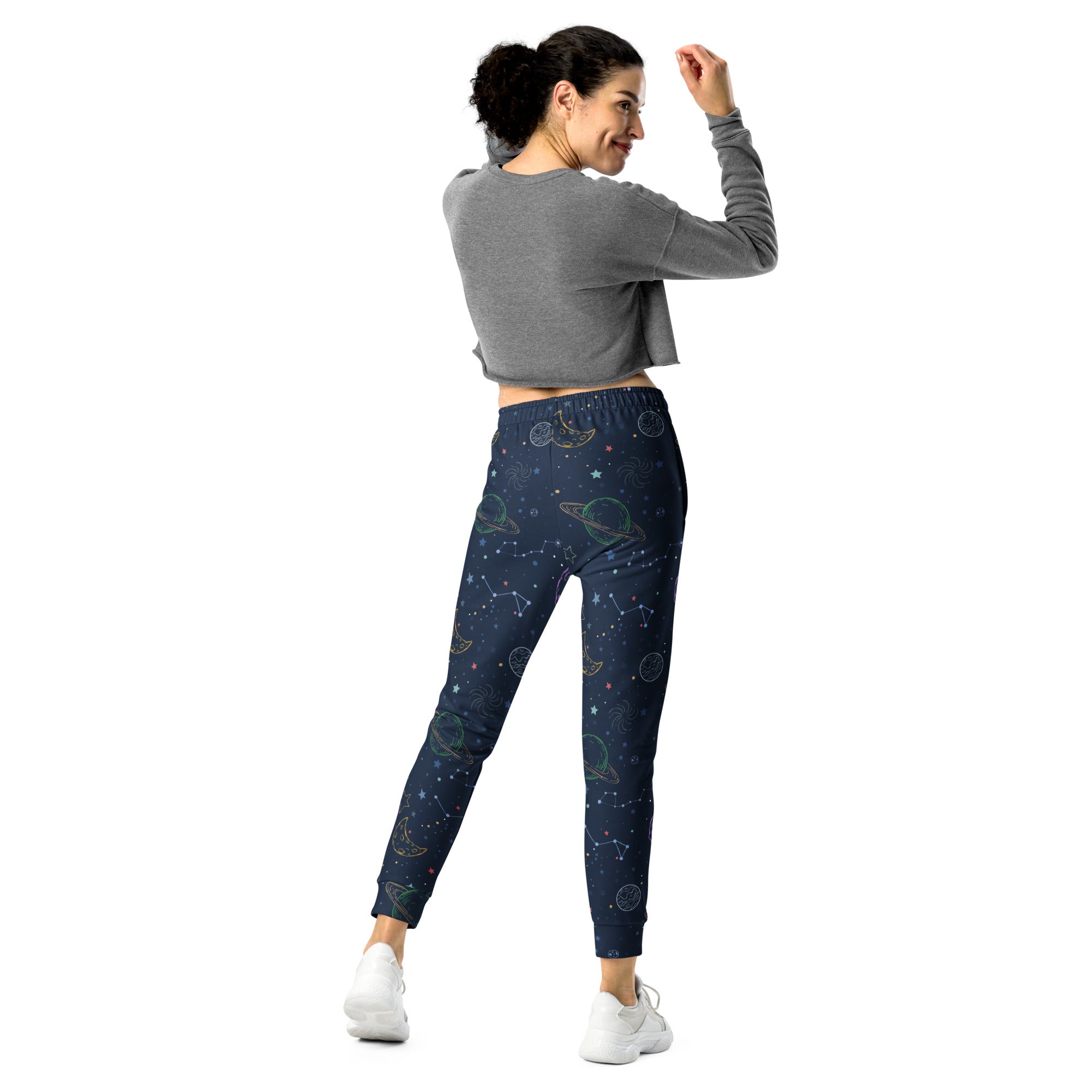 Dark blue women’s jogger pants with glowing green and white cosmic design cozy brushed fleece pockets