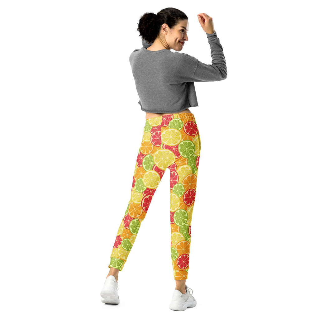 Women’s citrus slice recycled jogger pants with pockets in bright yellow orange green and red with cozy brushed fleece lining