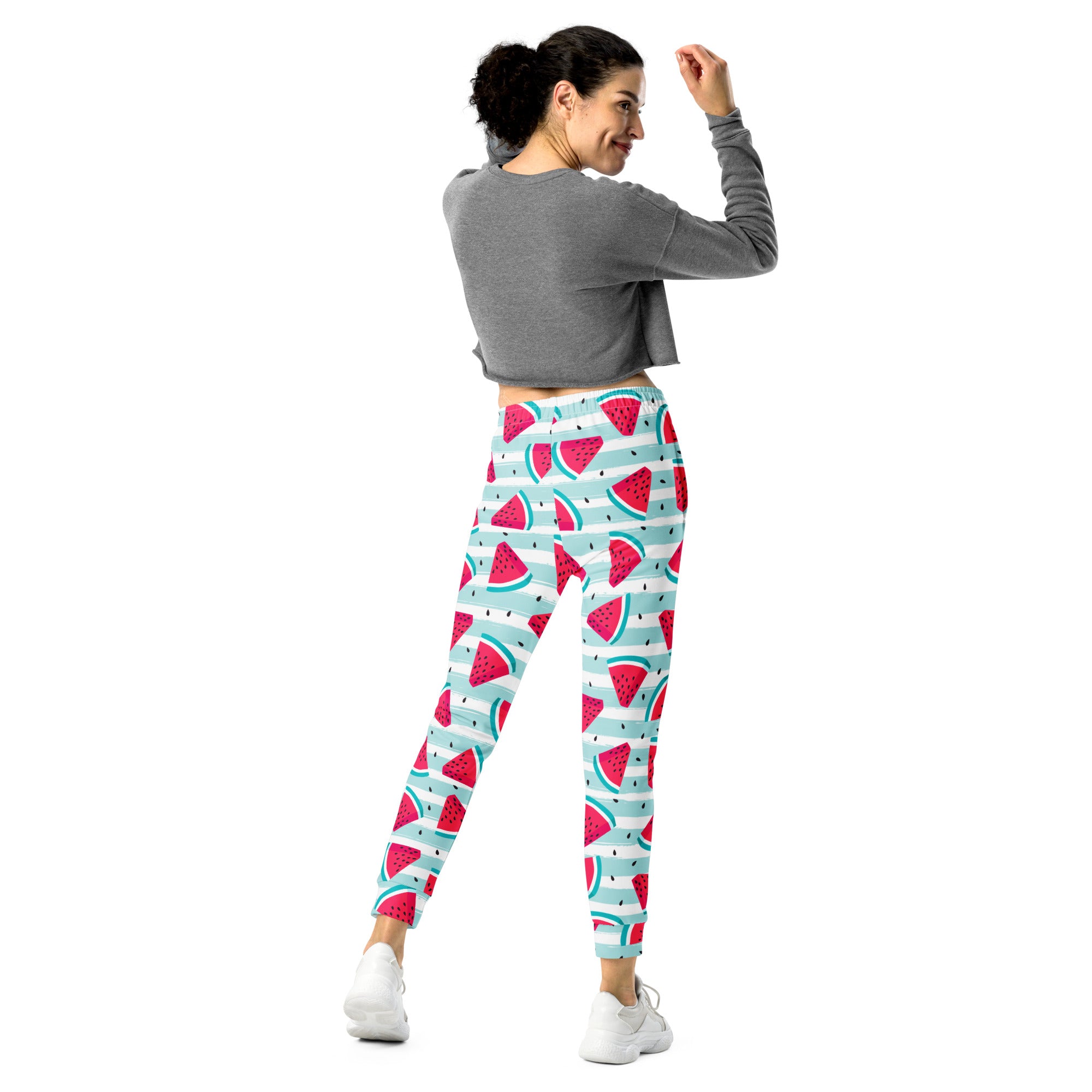 Women’s striped watermelon recycled jogger pants in vibrant red and teal with sliced watermelon design on light blue fleece