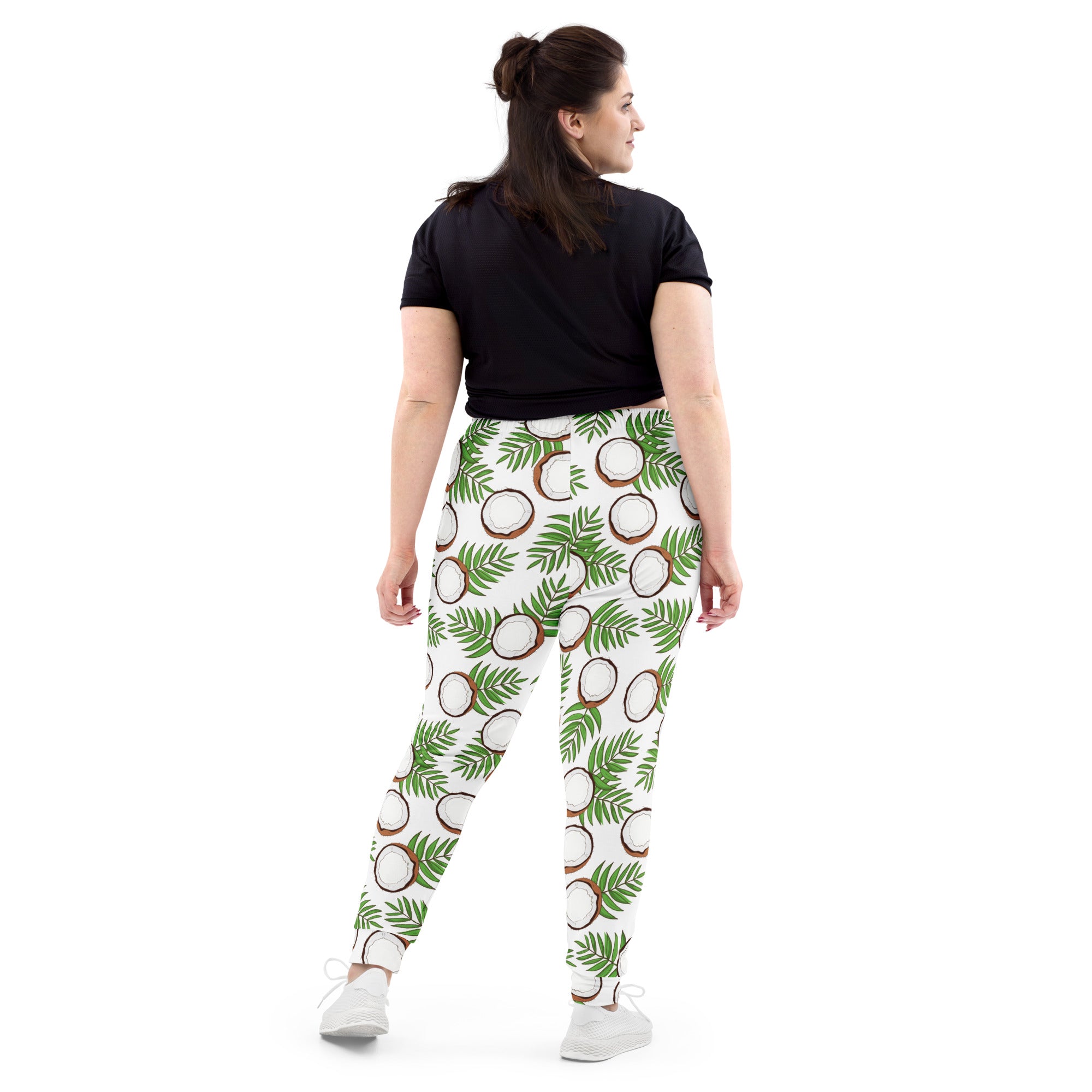 White leggings with green palm leaf and brown coconut pattern made from recycled fabric with cozy fleece lining