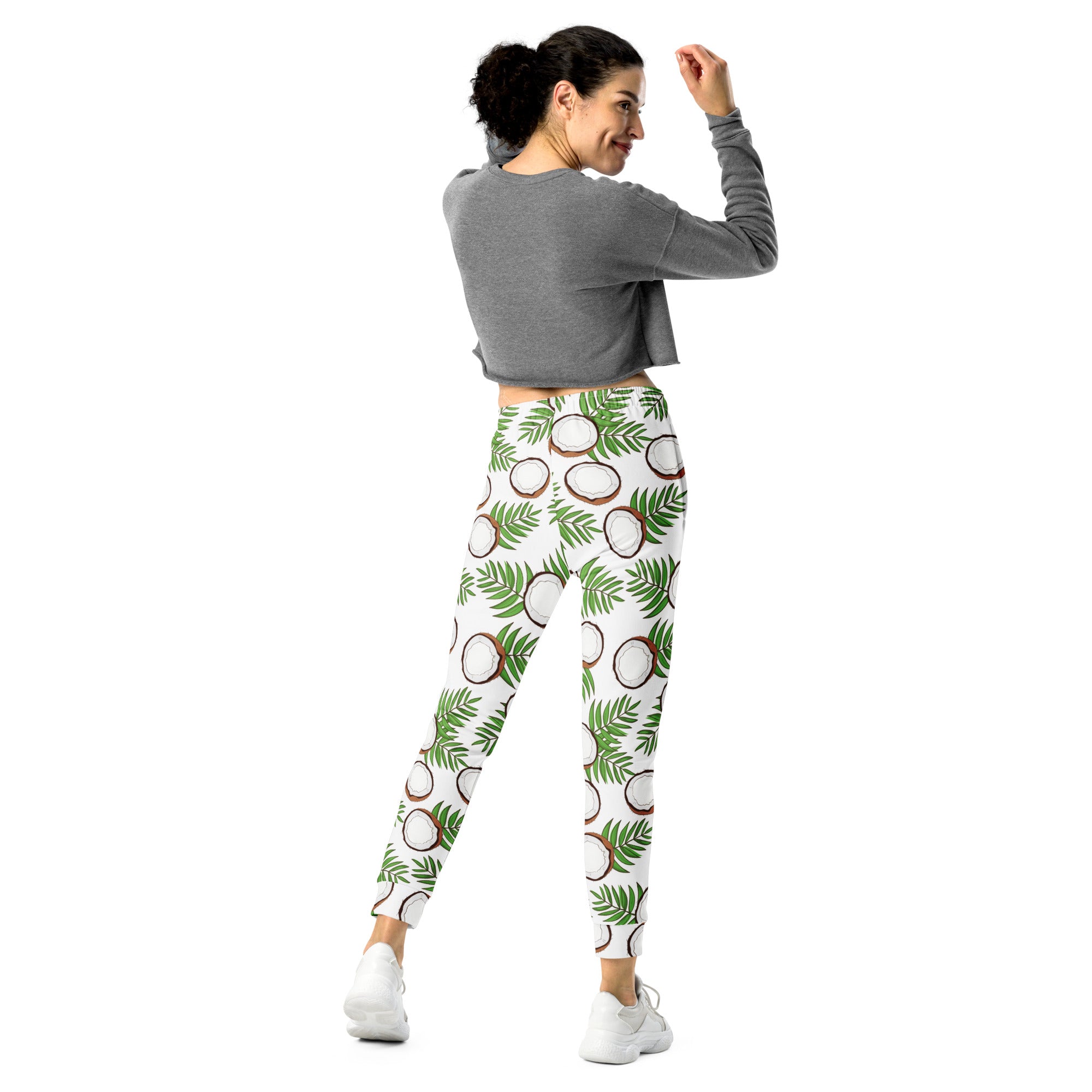 White leggings with vibrant halved coconut and green palm leaf pattern made from cozy recycled fleece with pockets