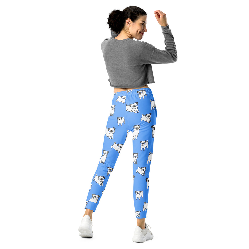 Women’s blue recycled jogger pants with cozy brushed fleece inside and playful white pug illustrations with pockets