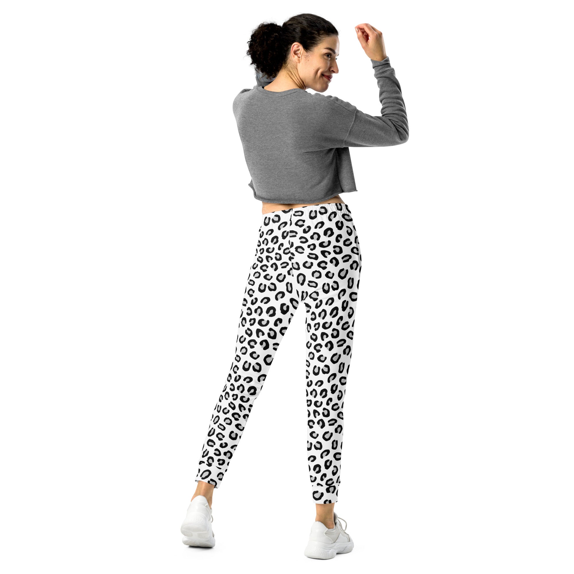 Women’s black and white leopard recycled jogger pants with pockets featuring white leggings with black leopard print