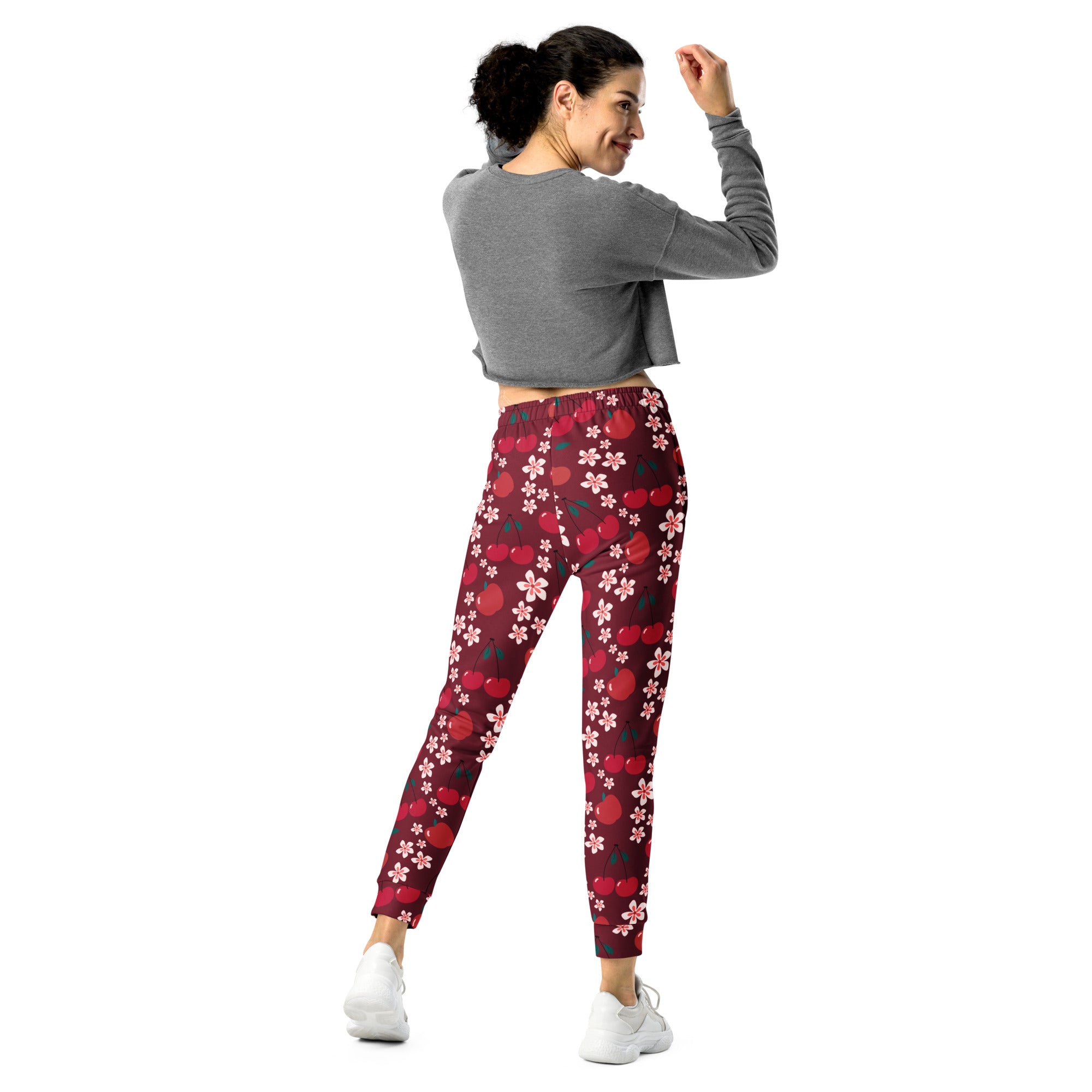 Women’s maroon cherry blossom recycled jogger pants with pockets featuring playful red cherries and pink blossoms