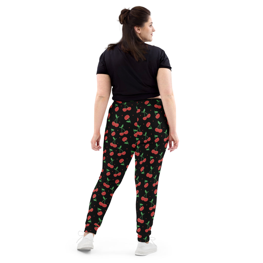 Women’s black cherry recycled jogger pants with red cherry print green stems cozy brushed fleece pockets