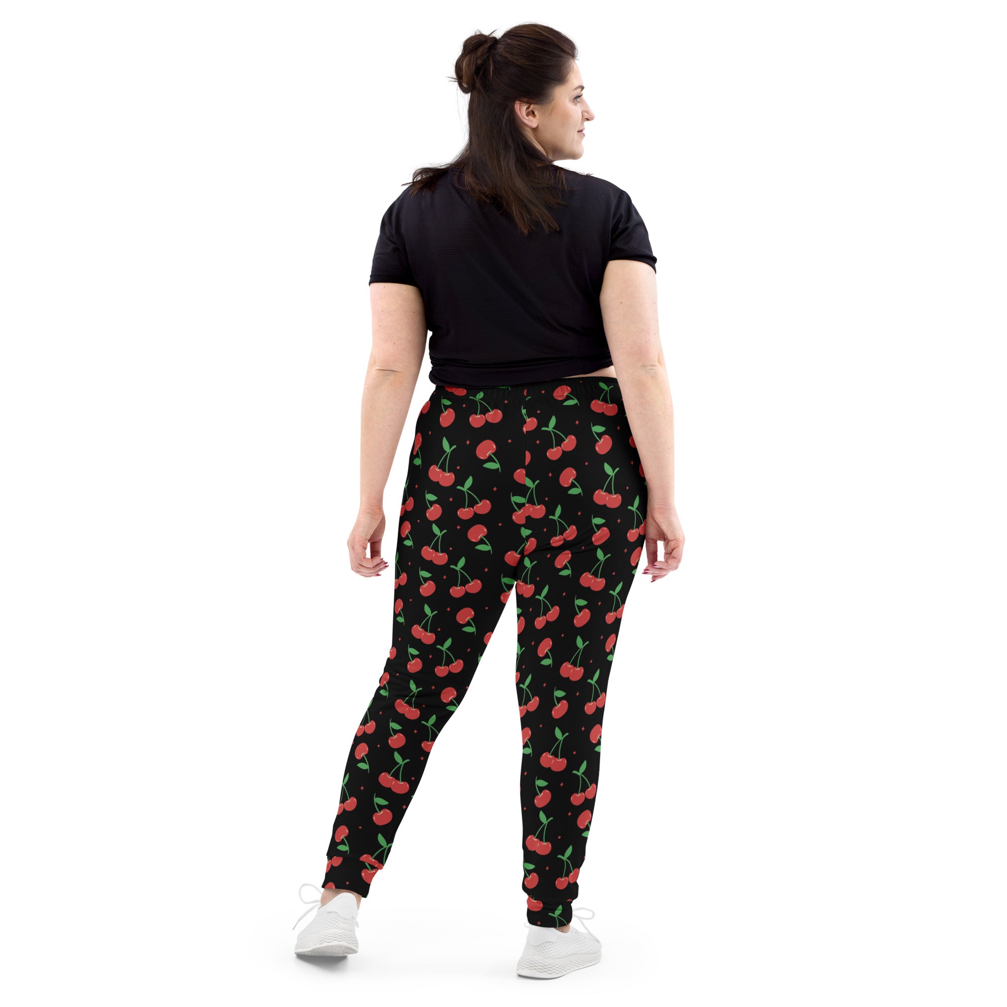 Women’s black cherry recycled jogger pants with red cherry print green stems cozy brushed fleece pockets
