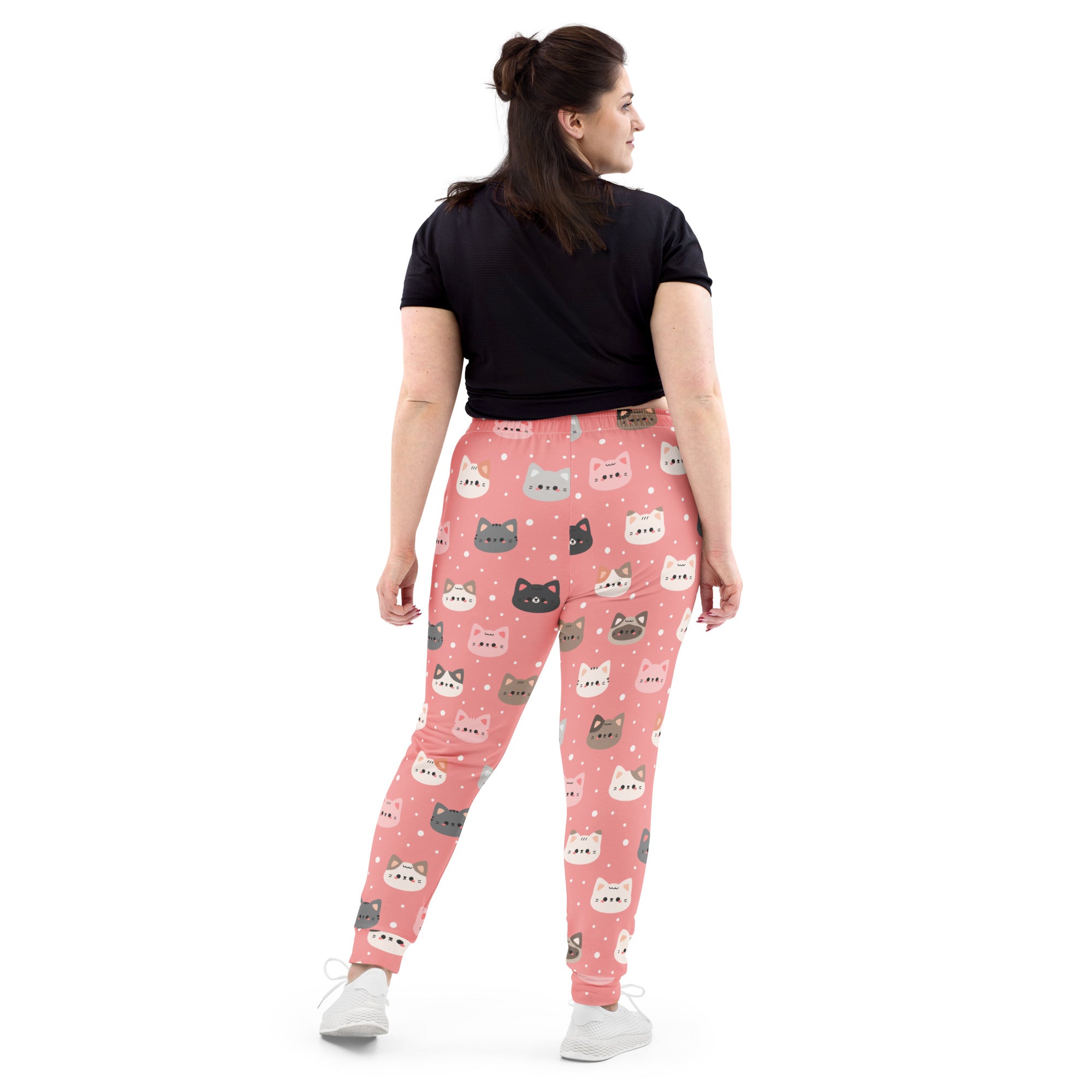 Women’s pink cat-themed leggings with soft stretchy recycled fabric and playful colorful cartoon faces and pockets