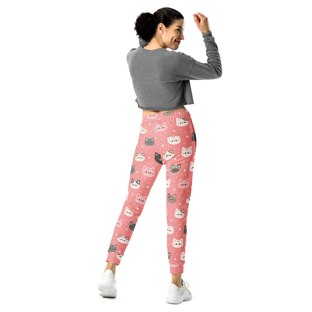 Women’s cute pink jogger pants with colorful cartoon cat faces made from cozy recycled fleece with pockets
