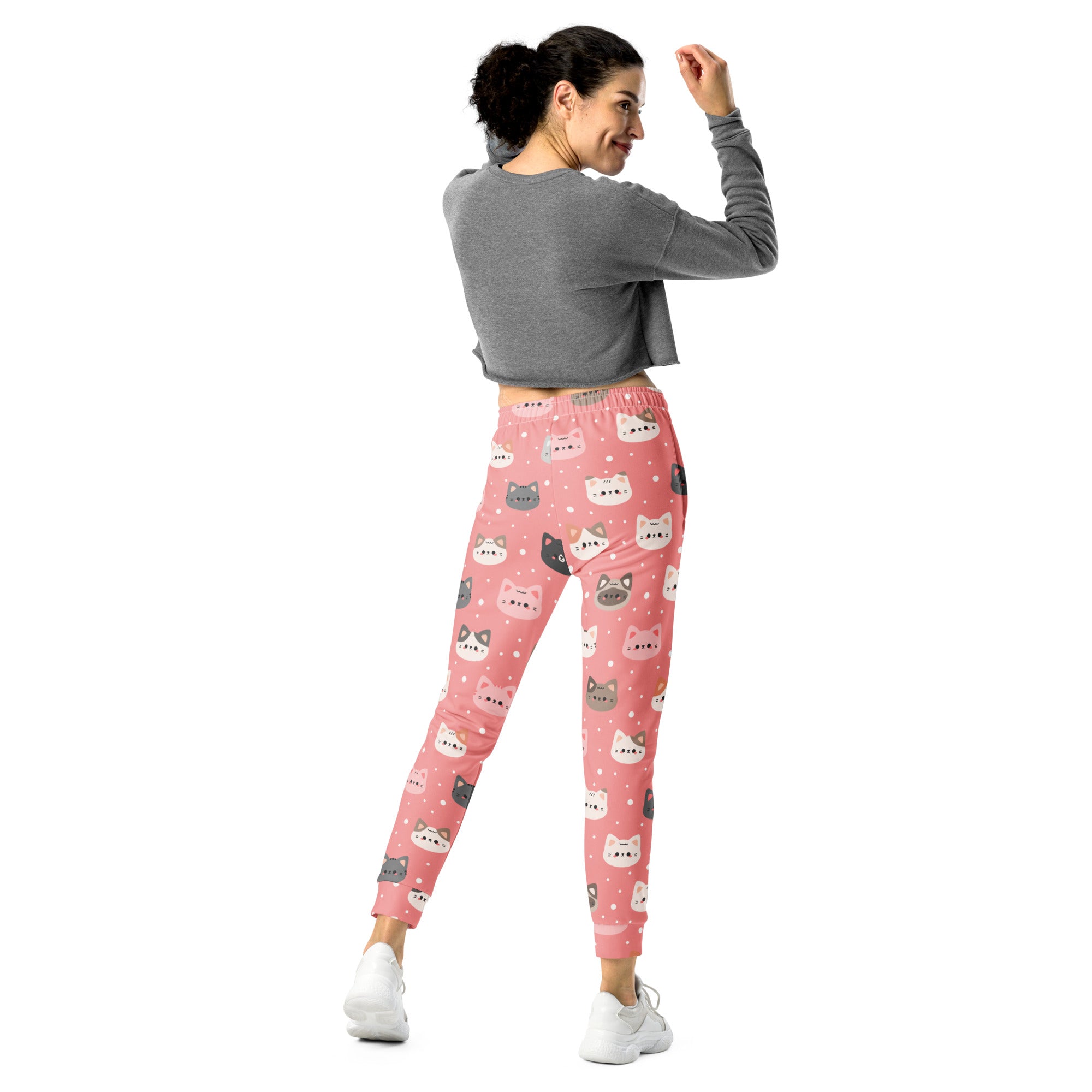 Women’s cute pink jogger pants with colorful cartoon cat faces made from cozy recycled fleece with pockets
