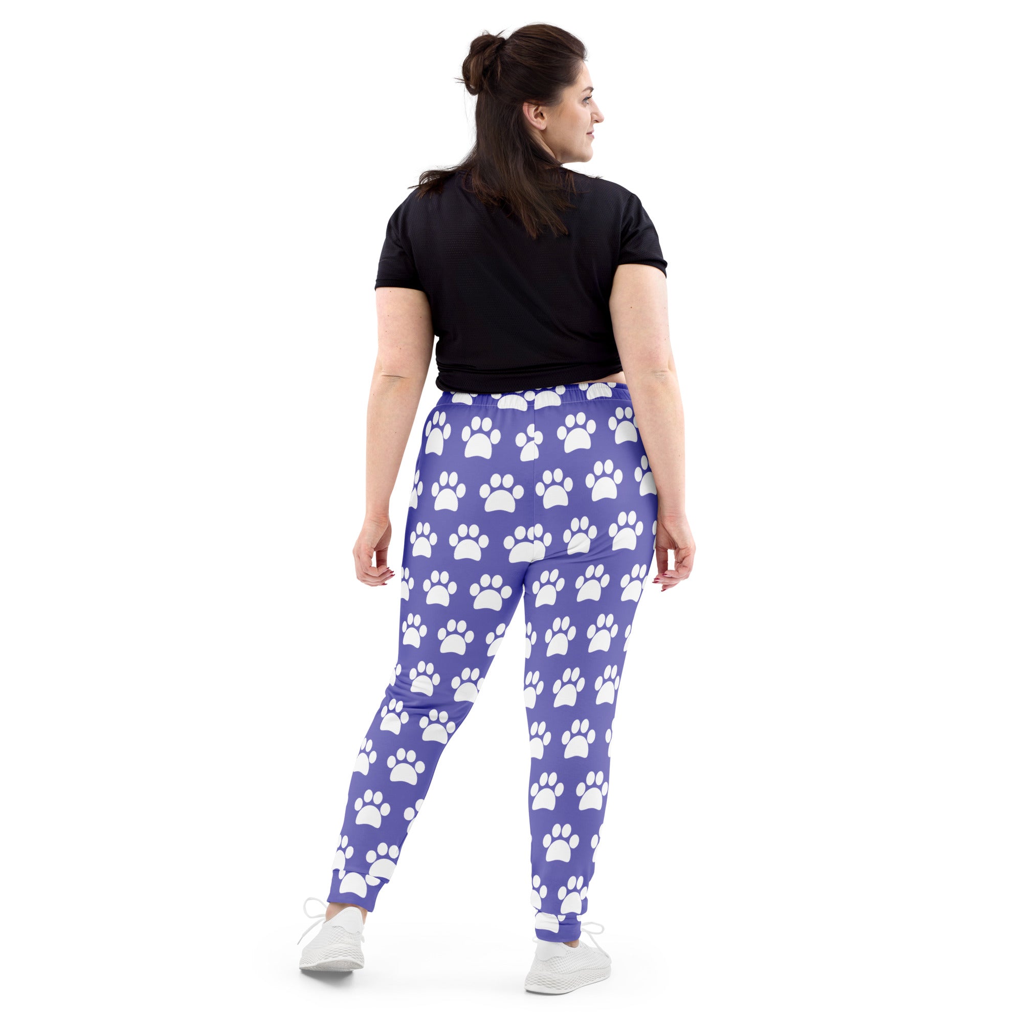 Women’s purple jogger pants with white paw print pattern cozy brushed inside fleece with pockets made from recycled material