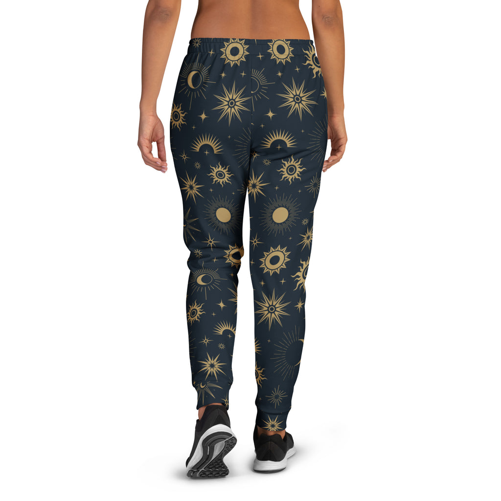 Dark blue women’s celestial sun and moon recycled jogger pants with vibrant gold pattern and cozy brushed fleece lining