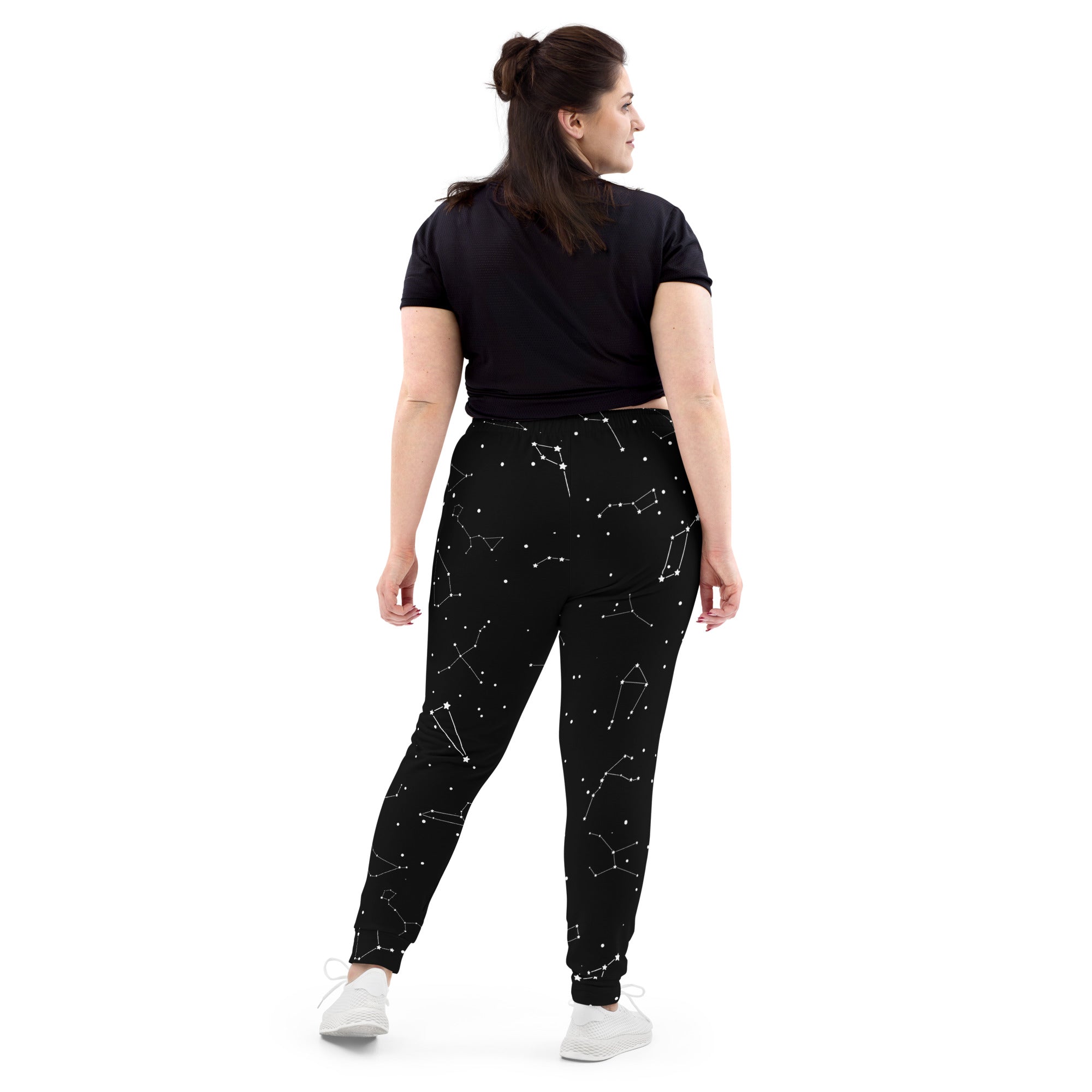 Women’s black jogger pants with white celestial constellation pattern made from cozy recycled brushed fleece with pockets