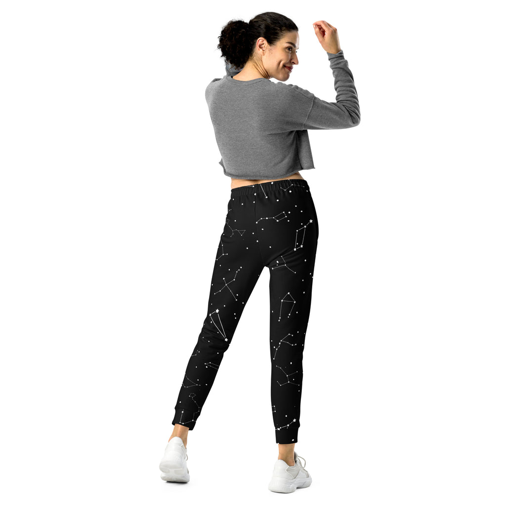Women’s black jogger pants with white realistic constellation pattern made from recycled fabric with cozy fleece inside