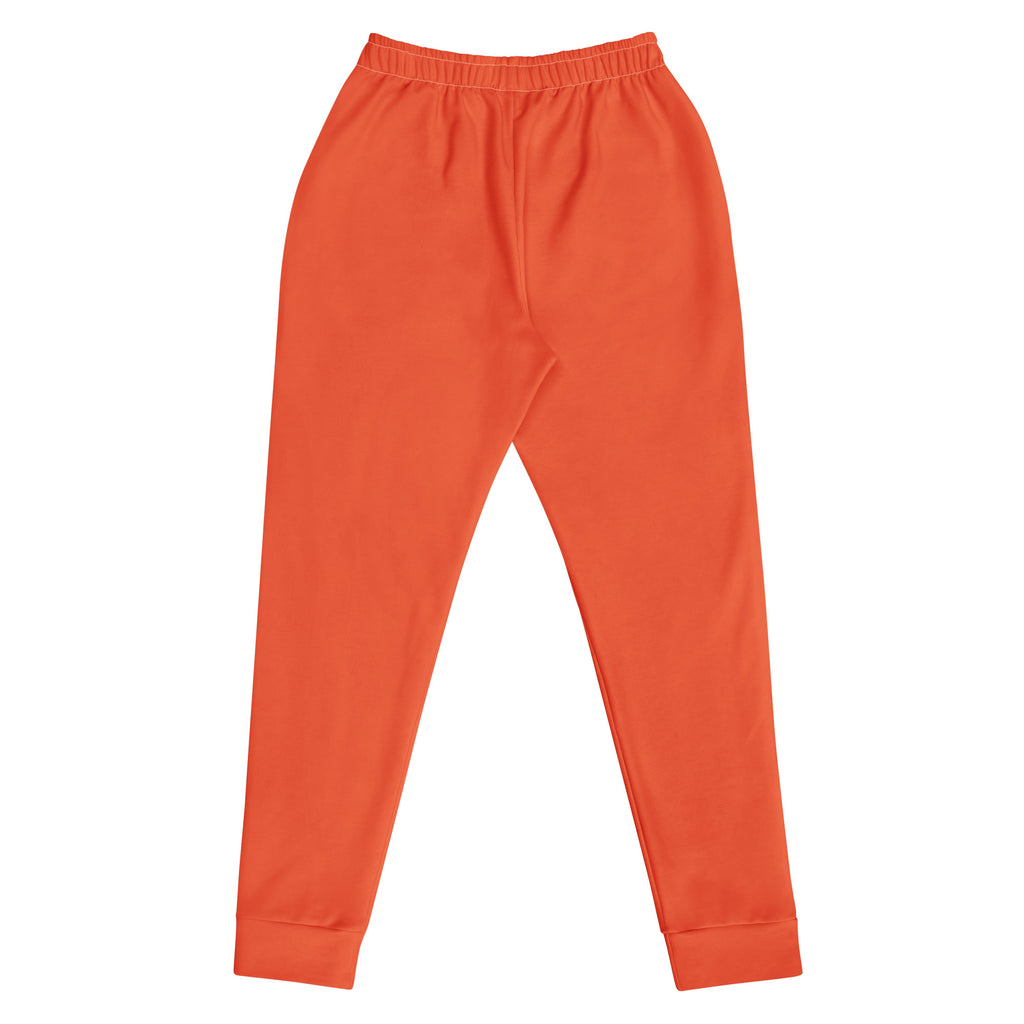 Women’s orange recycled jogger pants with pockets featuring an elastic waistband and ribbed cuffs in cozy fleece