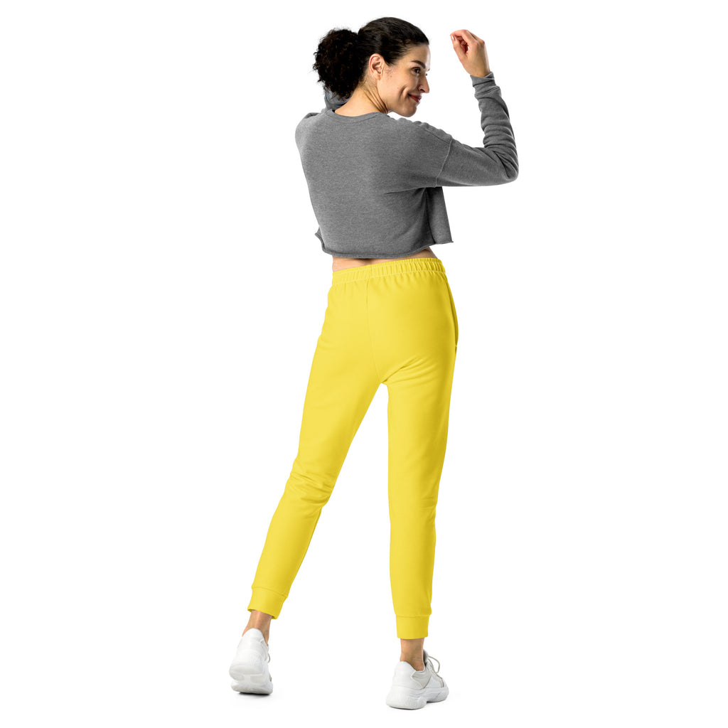 Women’s yellow recycled jogger pants with cozy brushed fleece inside snug elastic waistband and tapered legs with pockets