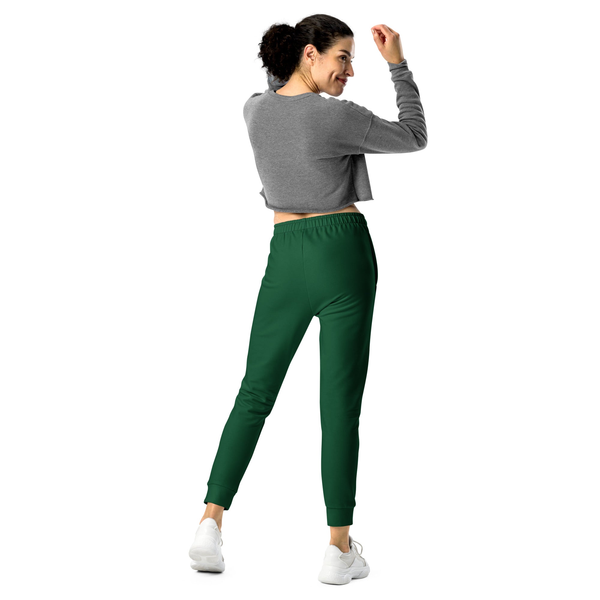 Women’s dark green slim-fit recycled jogger pants with elastic waistband cuffed ankles and cozy brushed fleece inside