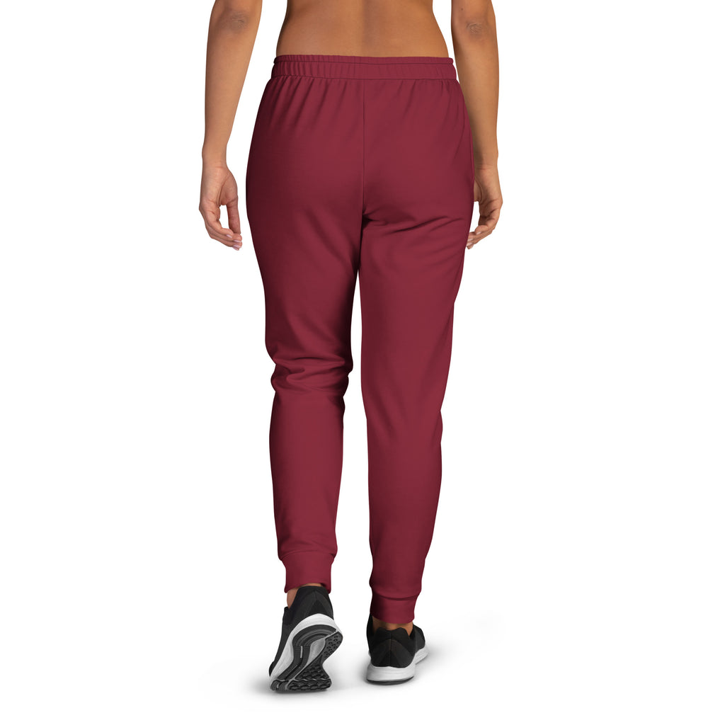 Women’s burgundy recycled jogger pants with pockets featuring cozy brushed inside fleece and a soft elastic waistband