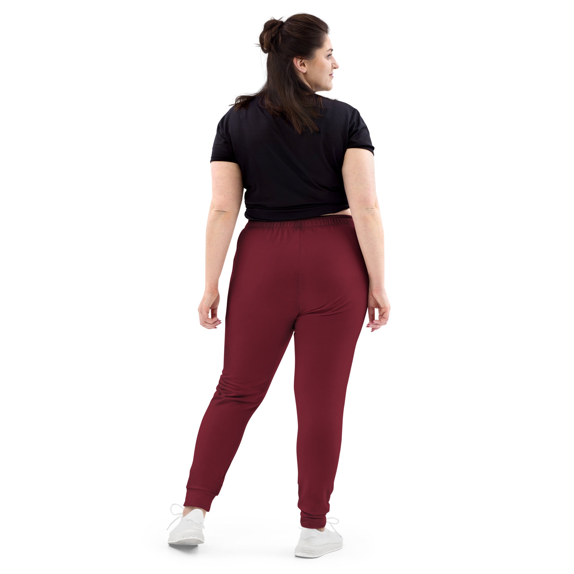 Women’s burgundy recycled jogger pants with pockets featuring a cozy brushed fleece inside elastic waistband and ribbed cuffs