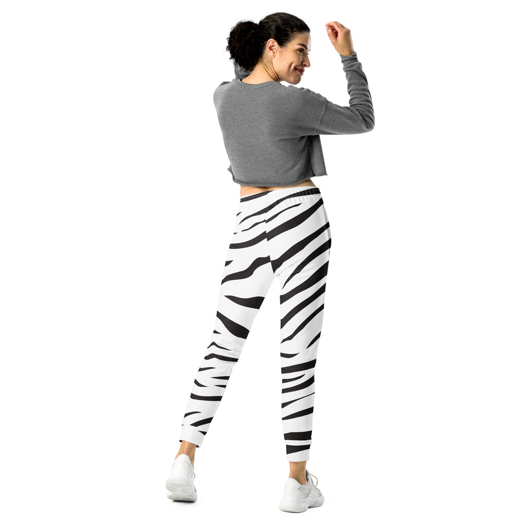 Women’s zebra print jogger pants in black and white with cozy brushed fleece and pockets for casual comfort