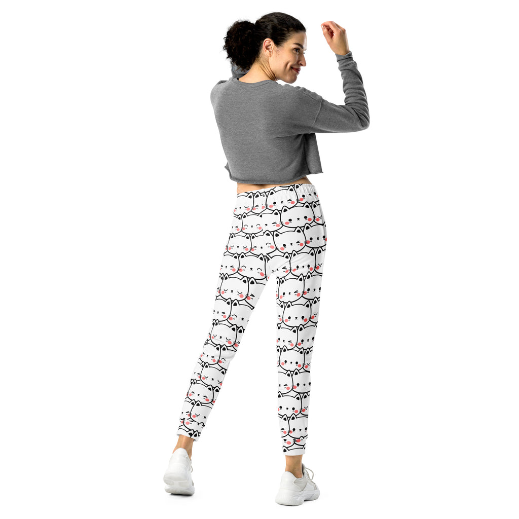 Women’s white cat print recycled jogger pants with pockets and cozy brushed fleece featuring cartoon cat faces