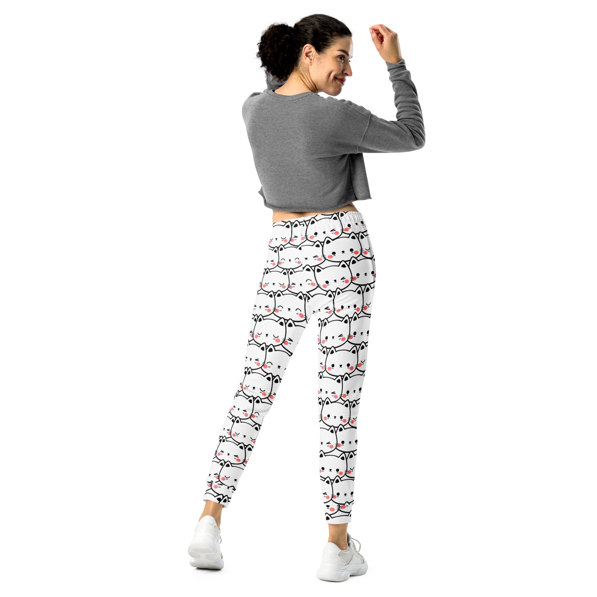 Women’s white cat print recycled jogger pants with pockets and cozy brushed fleece featuring cartoon cat faces