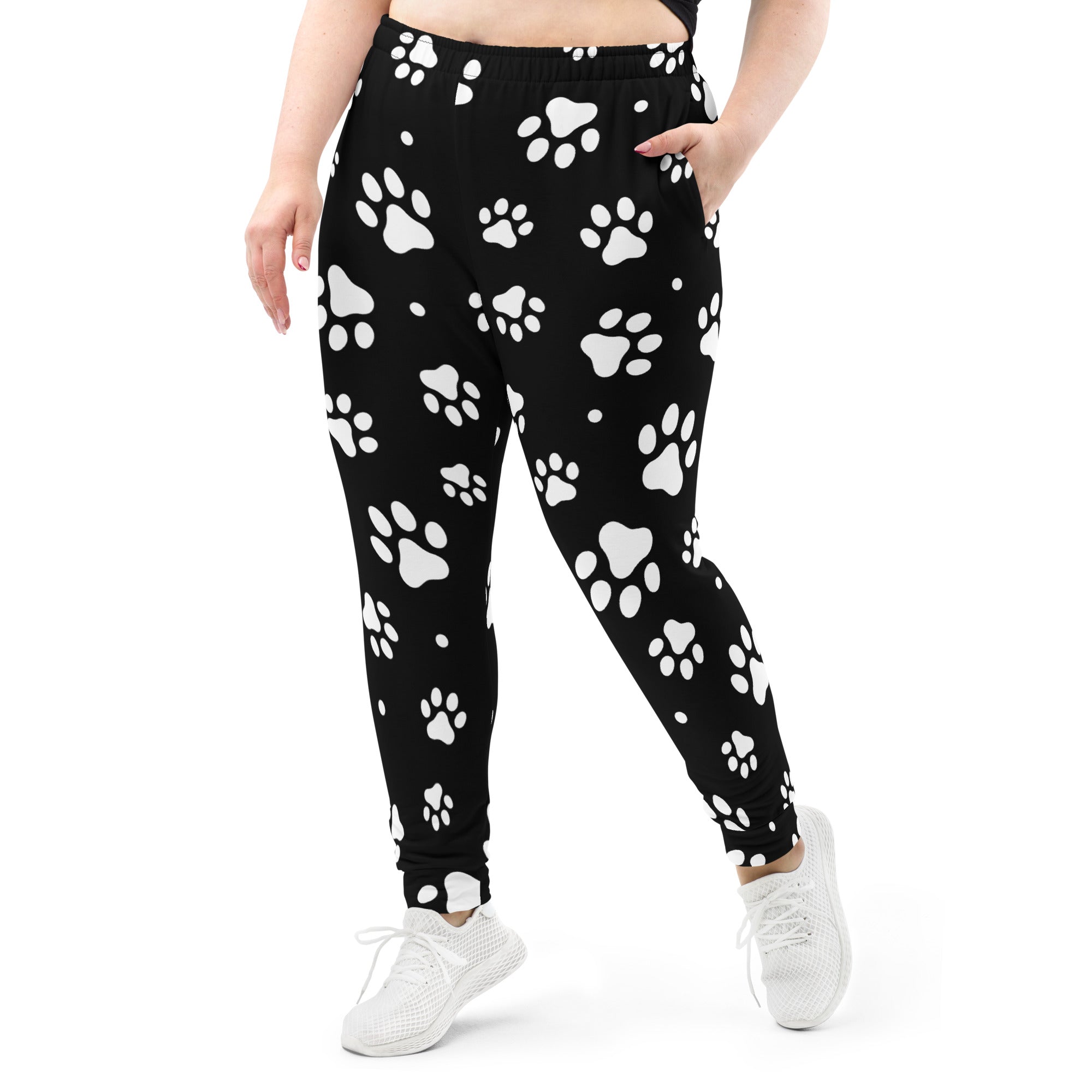 Women’s black jogger pants with white paw print pattern cozy brushed inside fleece and pockets made from recycled materials