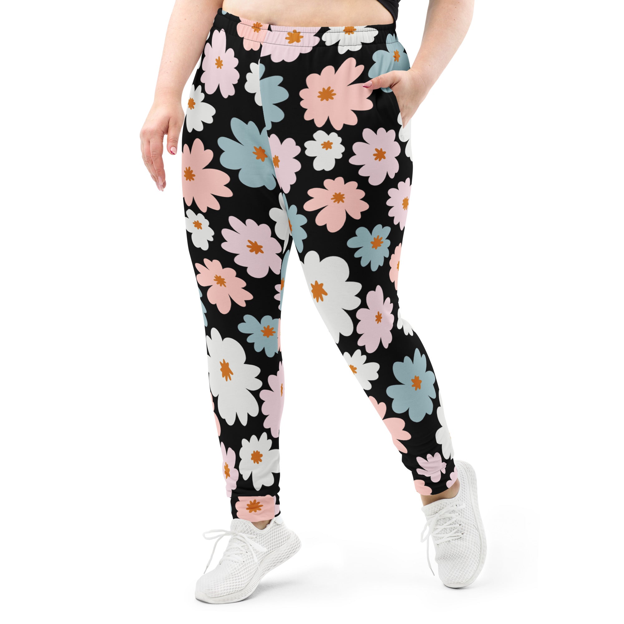 Women’s retro floral recycled jogger pants in black with pink white and blue flower pattern and cozy fleece lining