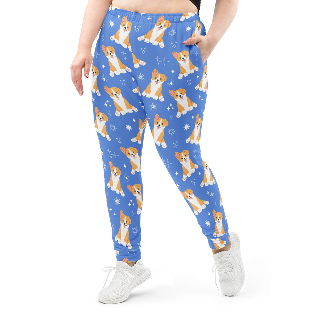 Women’s blue recycled jogger pants with cozy brushed fleece inside featuring orange and white corgi dog pattern