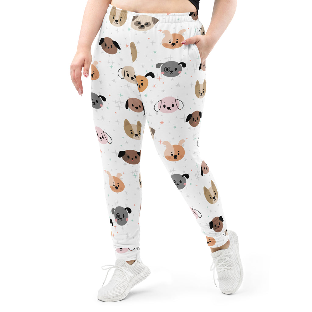 White women’s dog face recycled jogger pants with pockets featuring colorful cartoon dogs and cozy brushed fleece lining