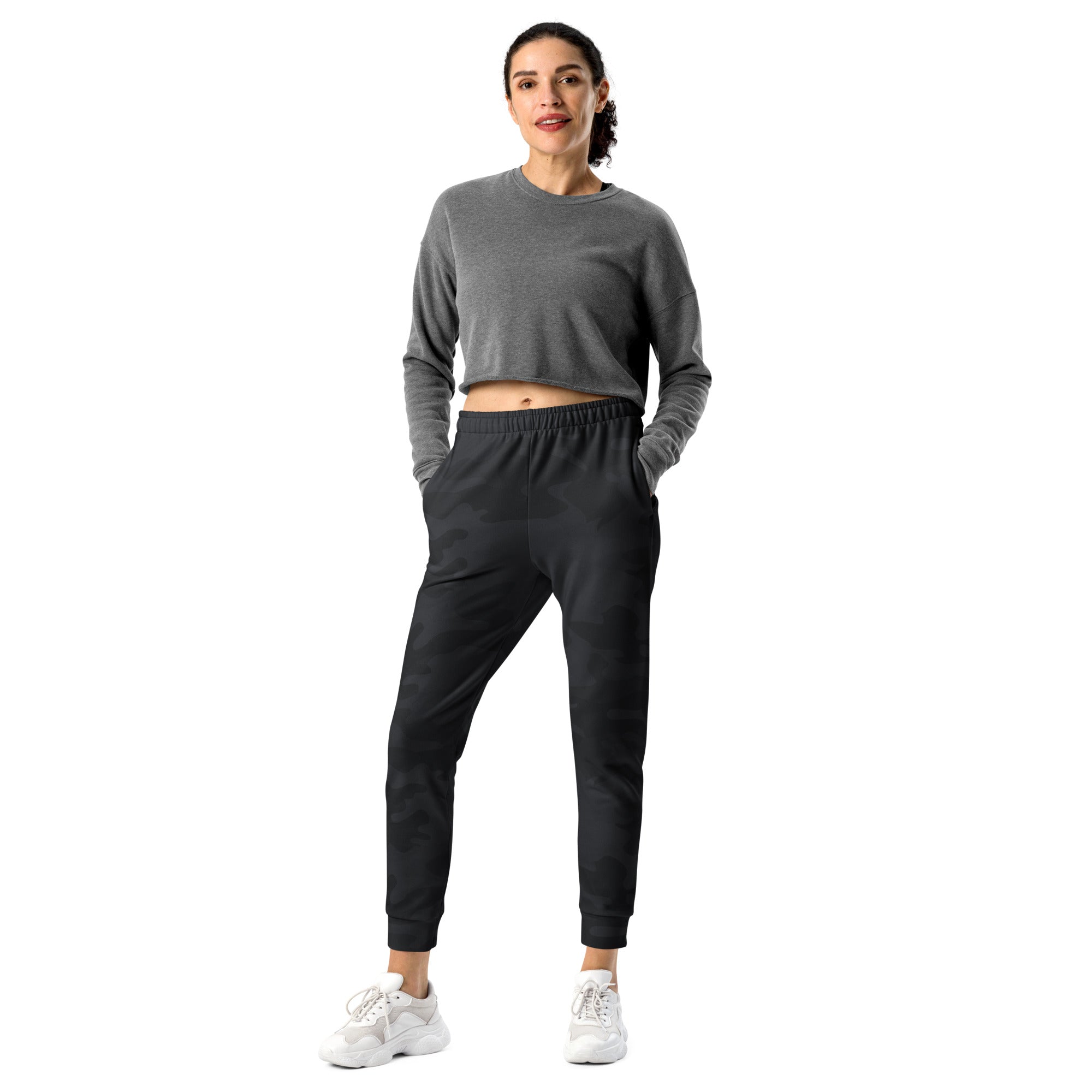 Gray cropped long-sleeve sweatshirt with elastic waistband and side pockets paired with women’s black camouflage recycled jogger pants with cozy fleece lining