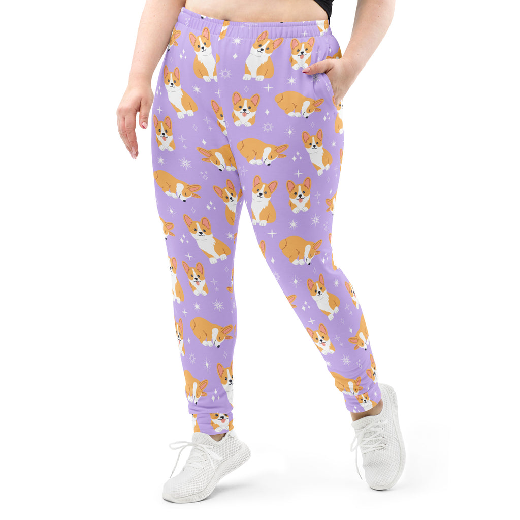Women’s purple recycled jogger pants with playful orange and white corgi pattern and cozy brushed fleece inside