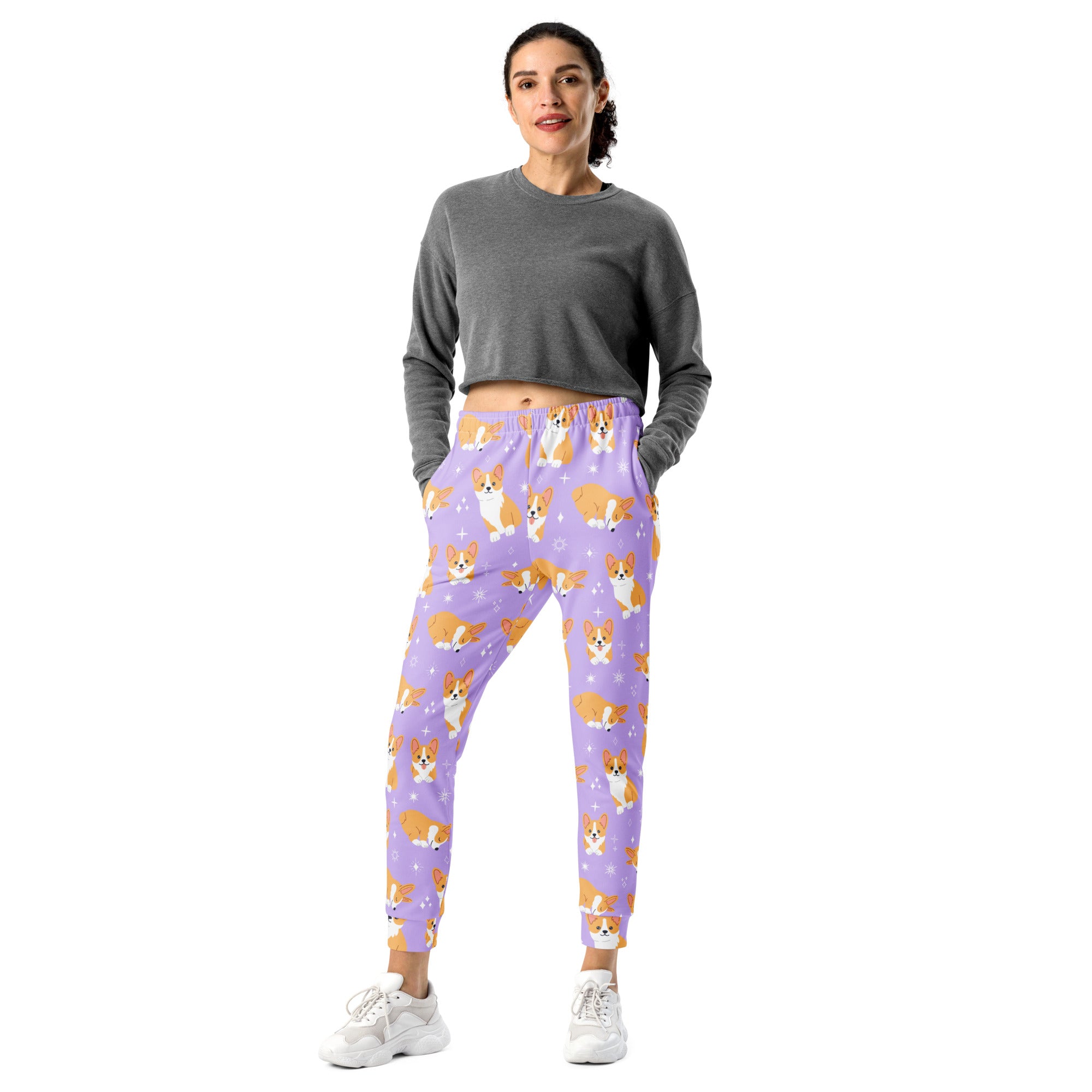Women’s purple recycled jogger pants with orange and white corgi pattern cozy brushed fleece inside pockets