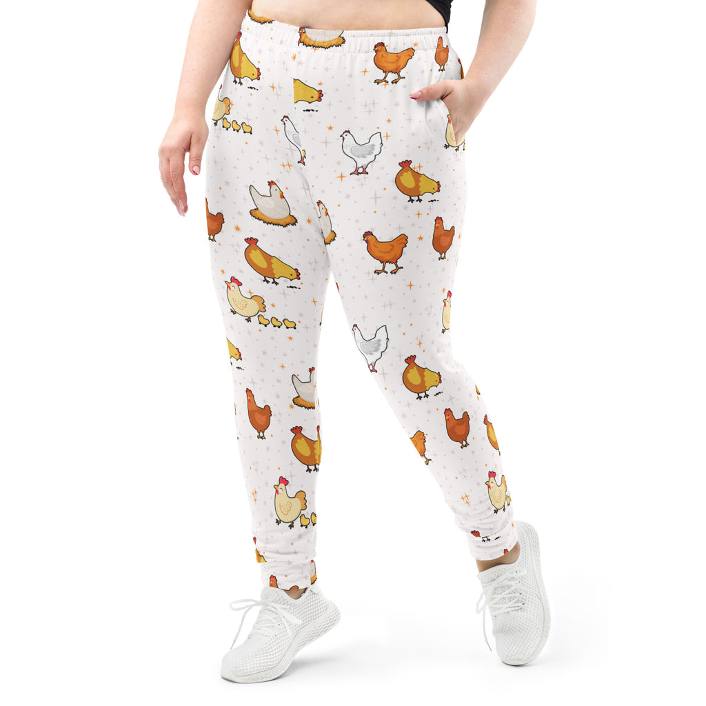White women’s chicken recycled jogger pants with pockets featuring orange yellow cartoon chickens and cozy fleece lining