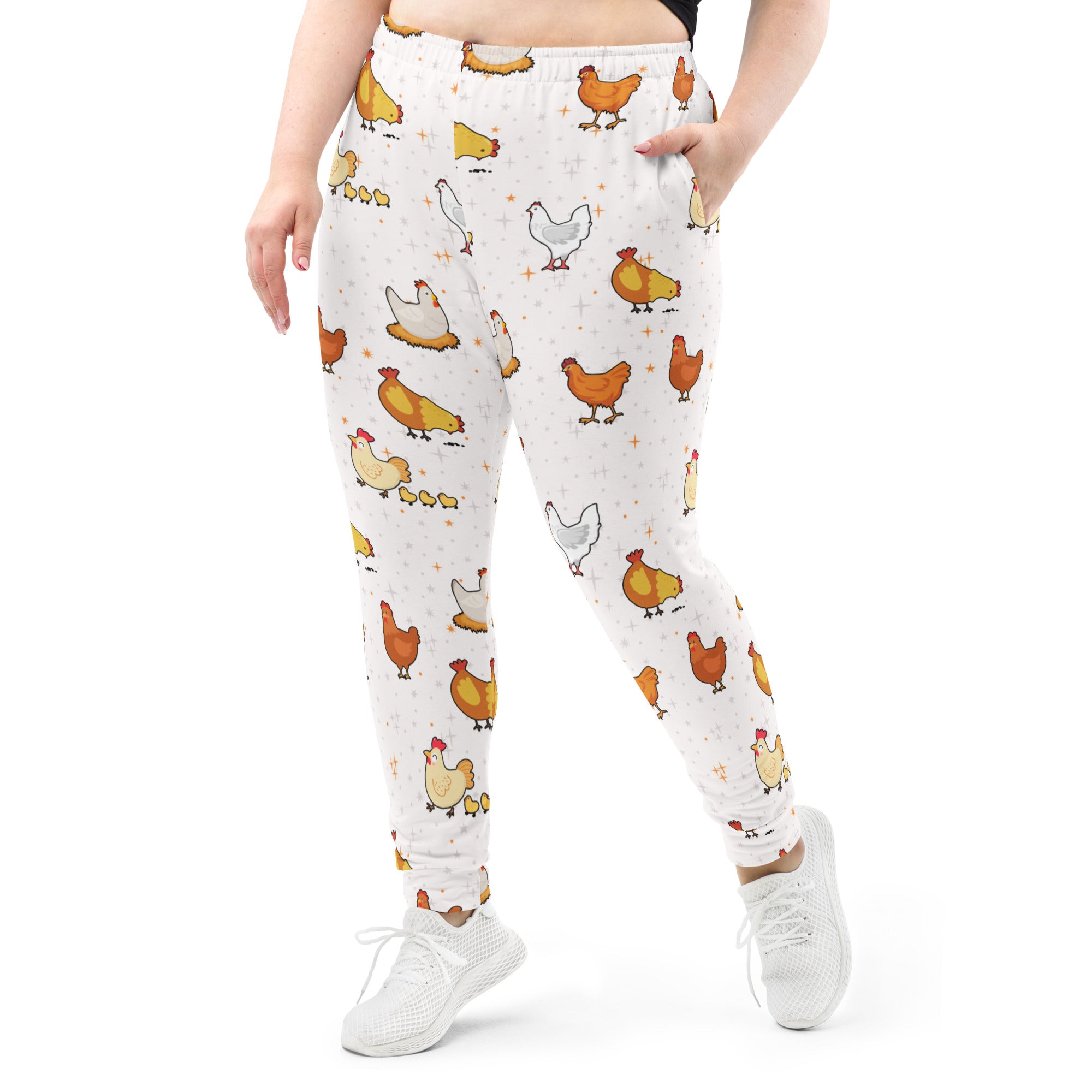 White women’s chicken recycled jogger pants with pockets featuring orange yellow cartoon chickens and cozy fleece lining
