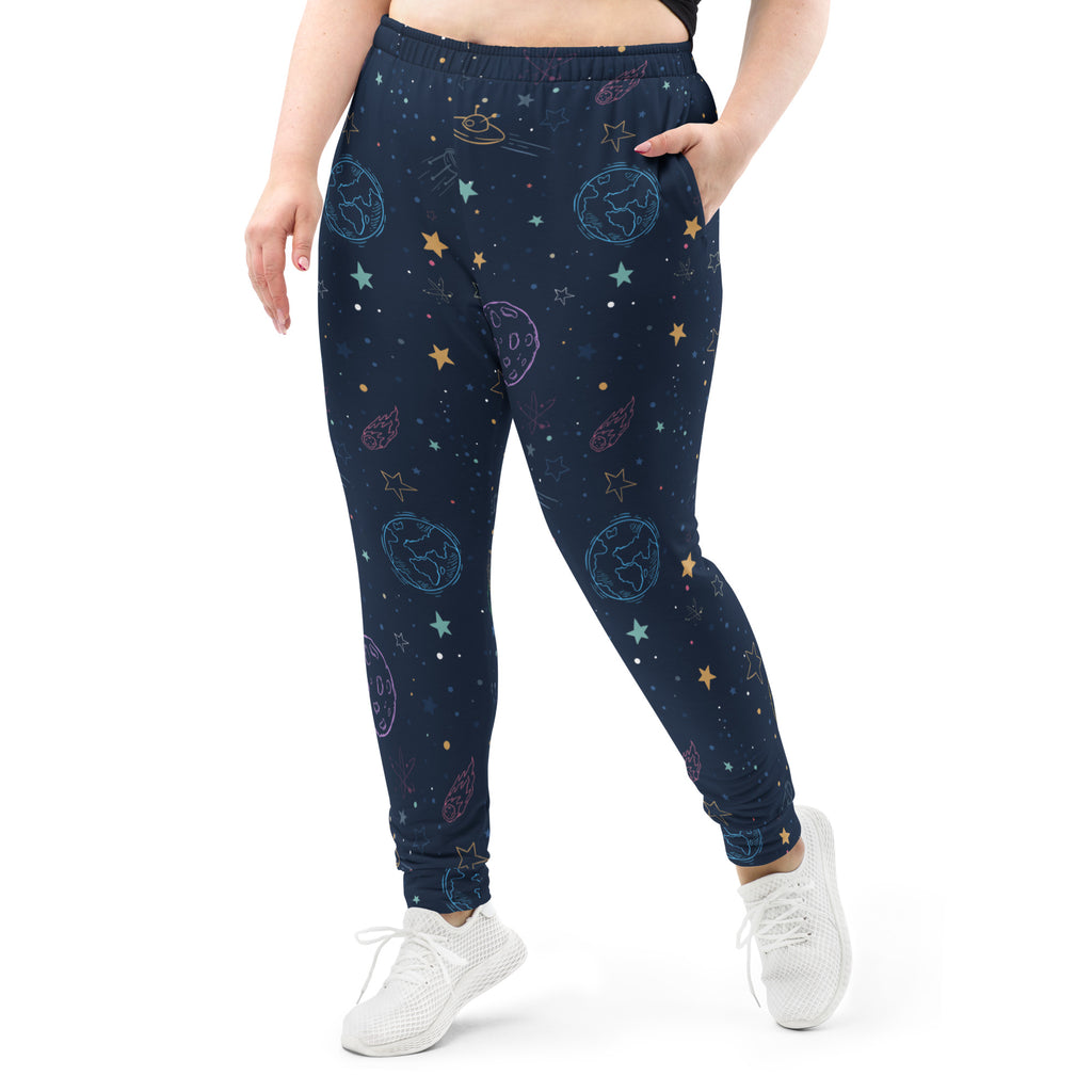 Women’s dark blue recycled jogger pants with cozy fleece lining featuring embroidered pastel glowing cosmic designs